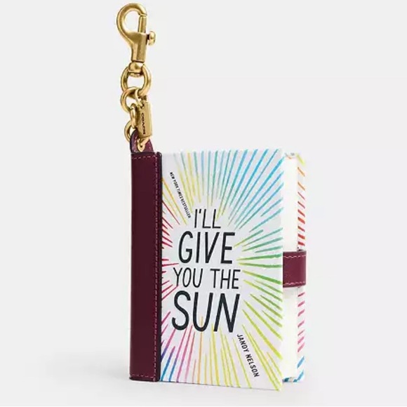 COACH Handbags - 🌞📚🌞 COACH  I’LL GIVE YOU THE SUN BY JANDY NELSON BOOK BAG CHARM 🌞📚🌞 NWT 🌞📚🌞